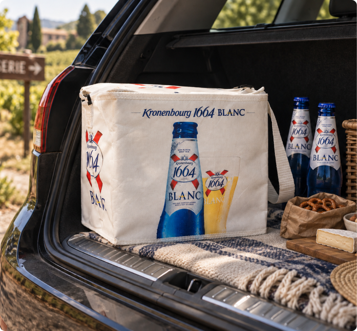 White Kronenbourg 1664 Blanc insulated shopping bag in a car boot