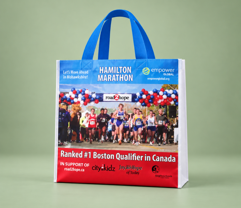 Blue reusable shopping bag printed with Hamilton Marathon event graphics