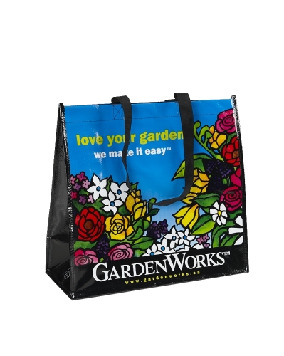 GardenWorks woven shopping bag with black handles and colourful floral printing