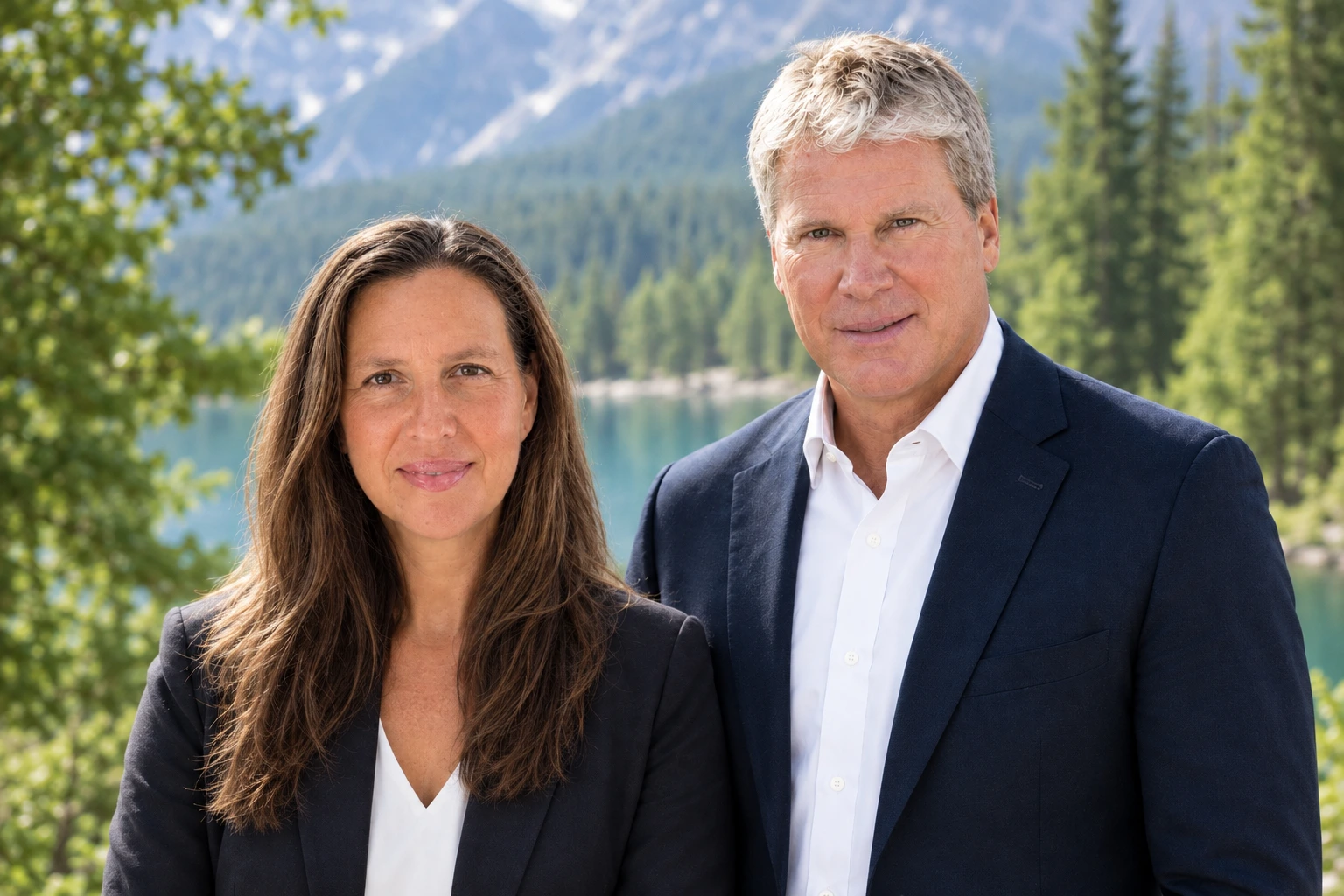Two Icegreen team members beside a mountain lake